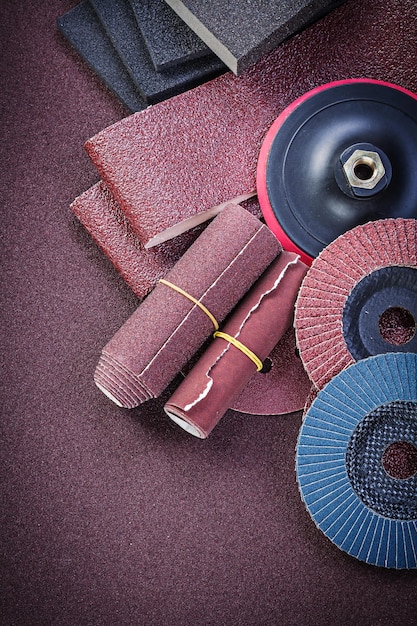 Collection of abrasive materials on polishing paper top view.