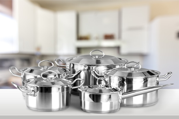 Collection of aluminum pans  on wooden table