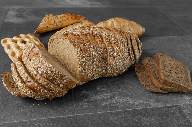 Collection of baked bread on dark background