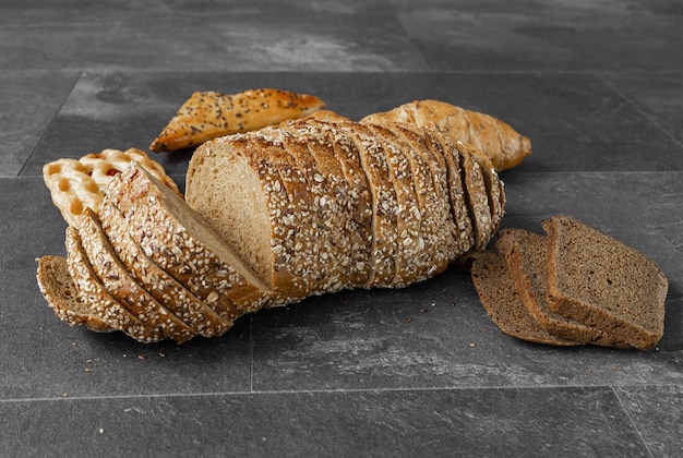 Collection of baked bread on dark background