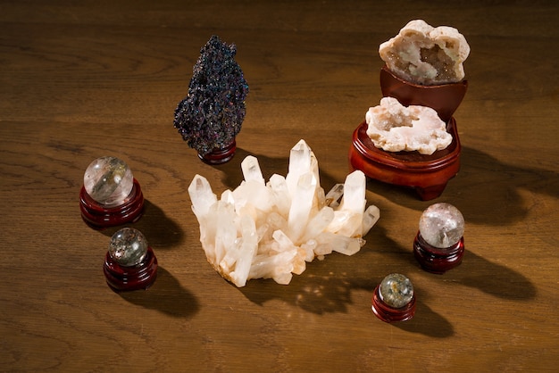 Photo collection of beautiful precious stones on wooden table.