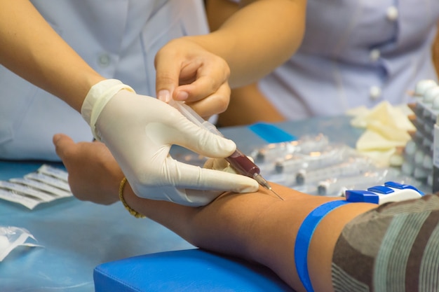 Collection blood in lab for checkup a health check by doctor and nurse