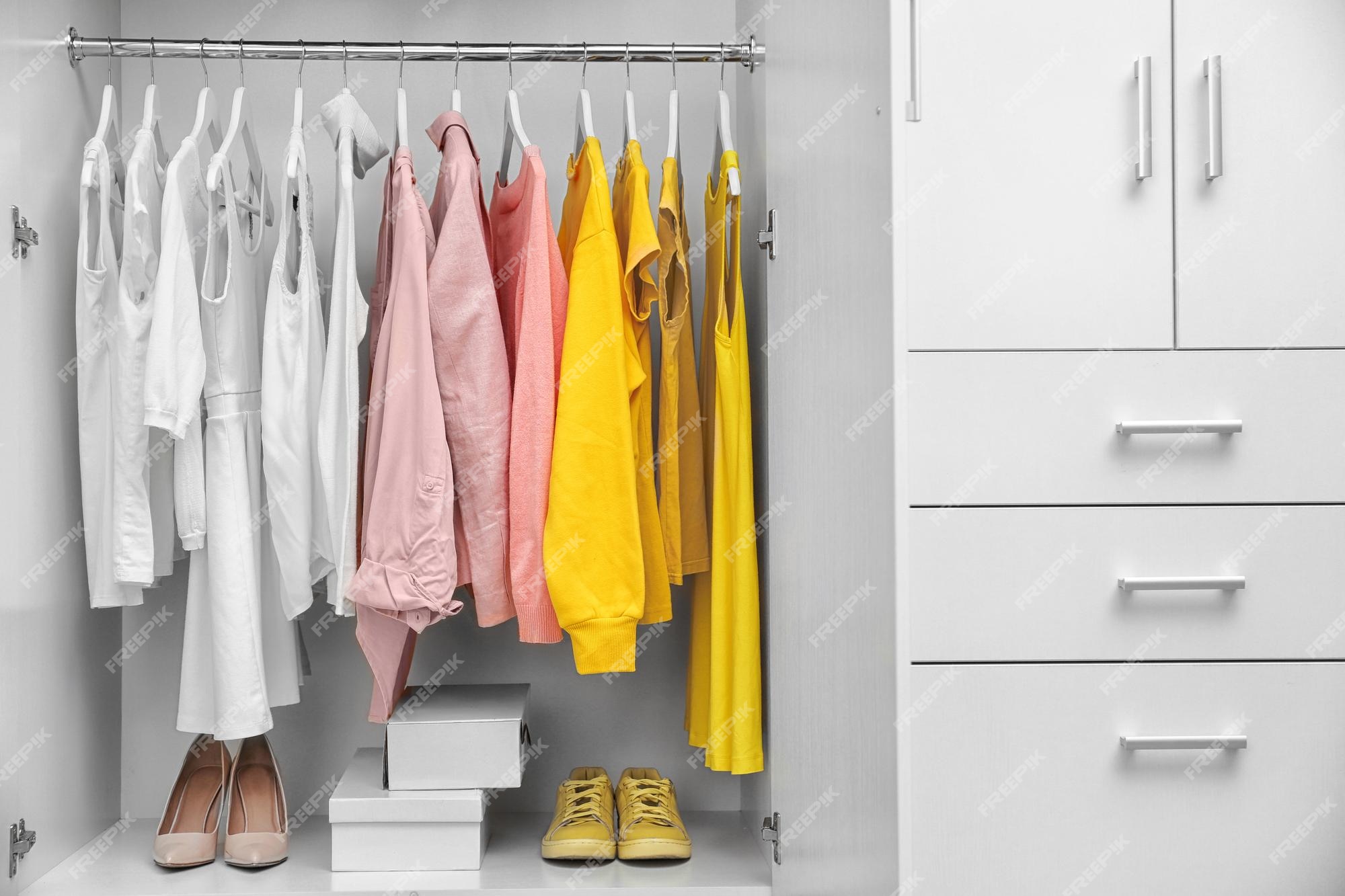 Premium Photo | Collection of clothes hanging on a rack