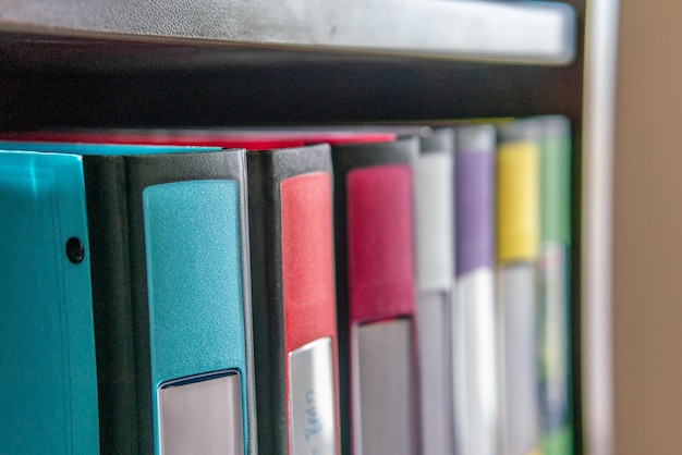 Photo collection of color coded binders to keep documents