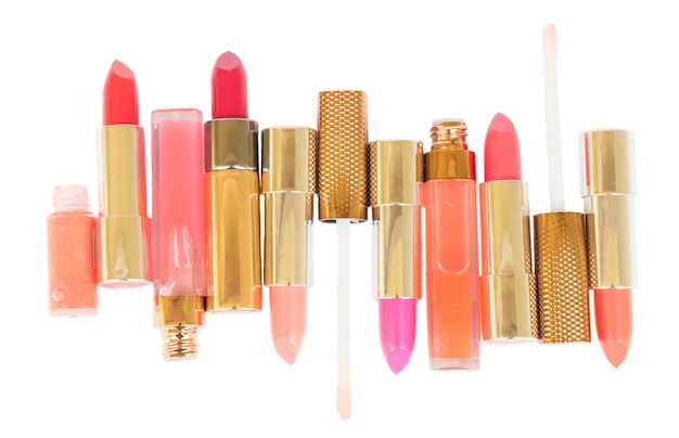 Collection of colorful pink and red lipsticks isolated on white background