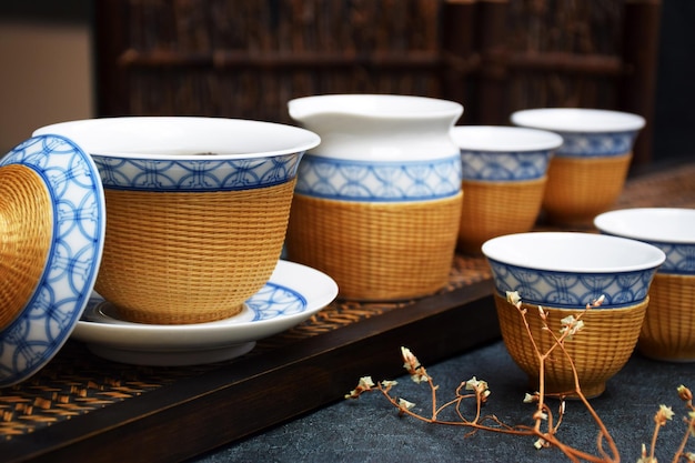 A collection of cups and saucers are on a table.