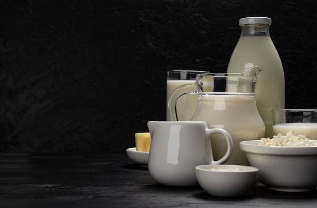 Collection of dairy products on black wooden