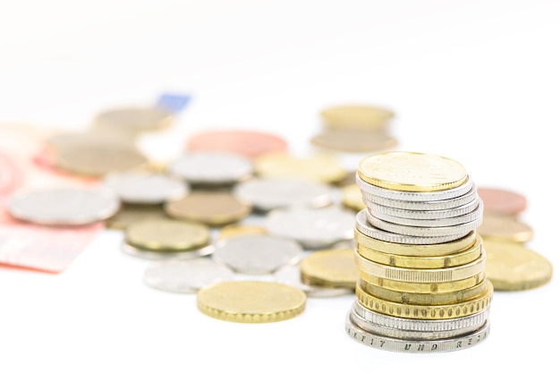 Collection of different coins and banknotes in macro shot