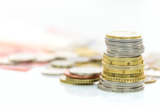 Collection of different coins and banknotes in macro shot