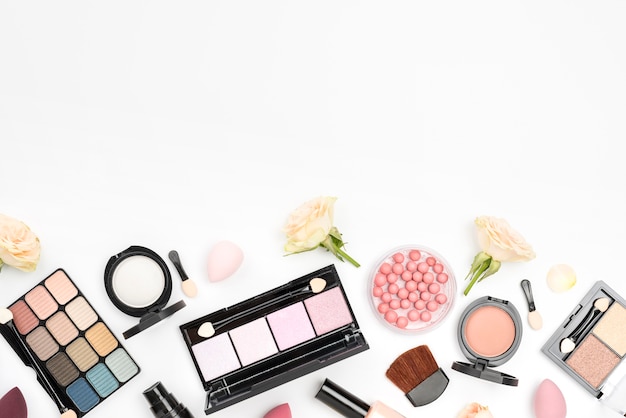 Collection of different cosmetics with copy space on white background