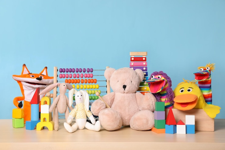 Photo collection of different toys on wooden table