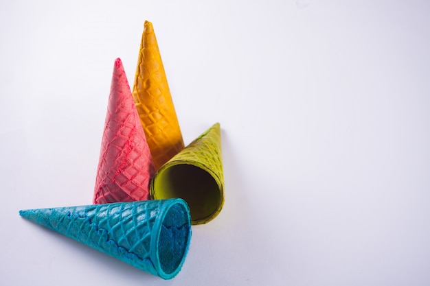 Collection of empty colorful ice cream cone on white 