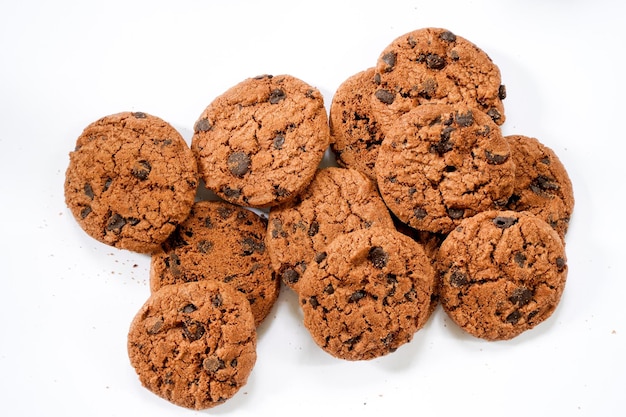 Collection of half chocolate chip cookies on white background