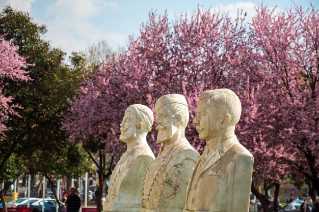 Photo a collection of images featuring various statues and monuments in thessaloniki