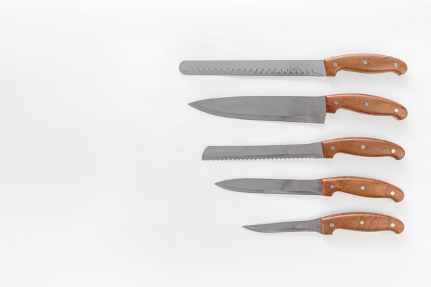 The collection of kitchen knives on white background Creative layout Chef restaurant or kitchen concept