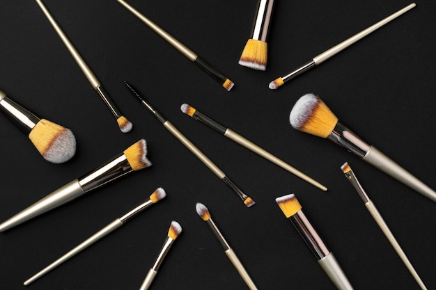 Collection of make up brushes on black background, close up