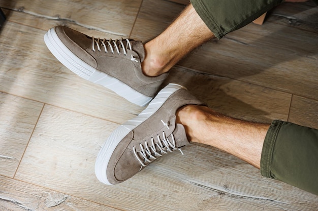 Photo collection of mens summer shoes male legs in beige leather sneakers mens classic shoes