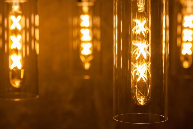 Photo collection of modern glowing bulbs hanging near wall