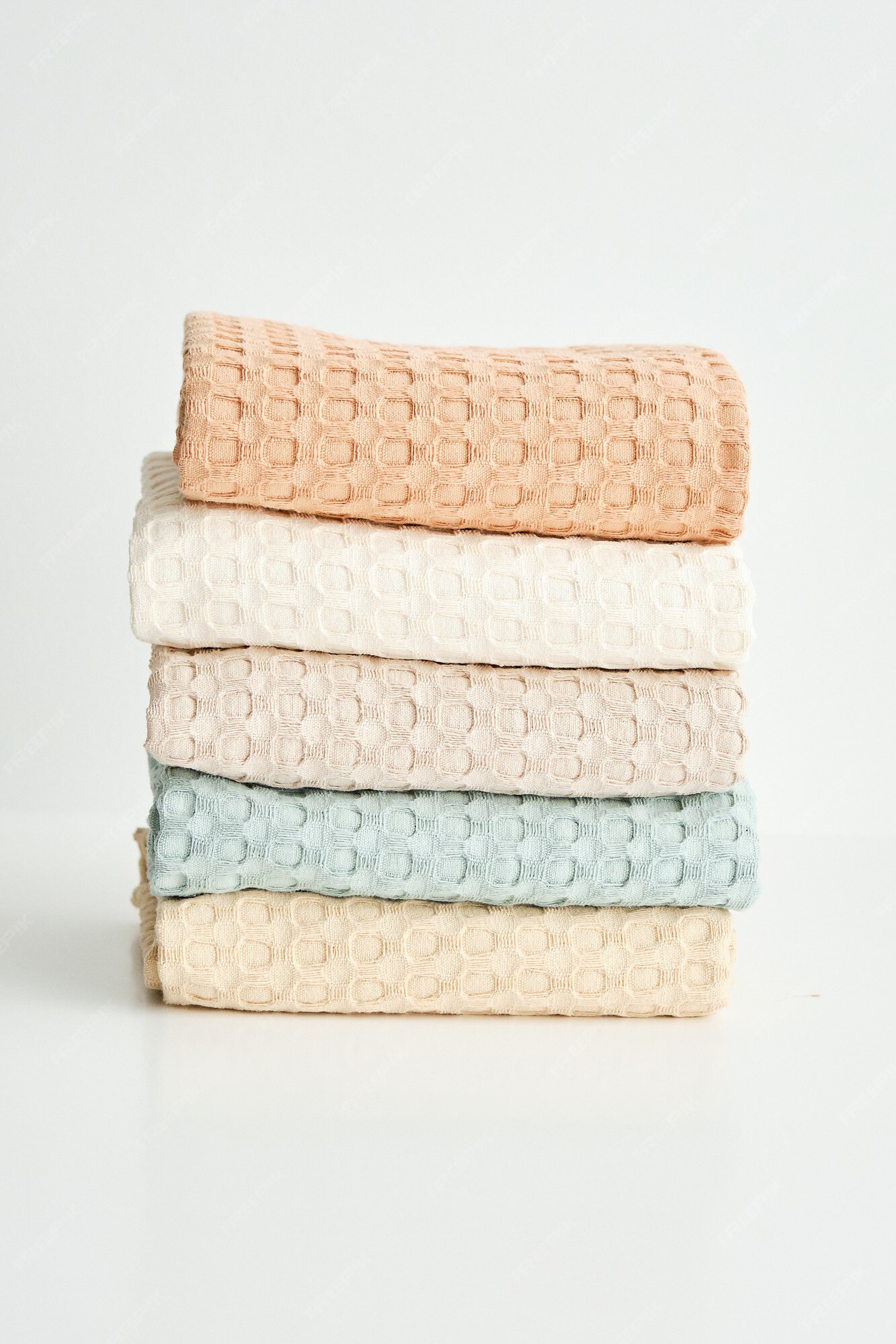 Premium Photo  Collection of natural muslin kitchen towels stacked neatly  in a vertical stack