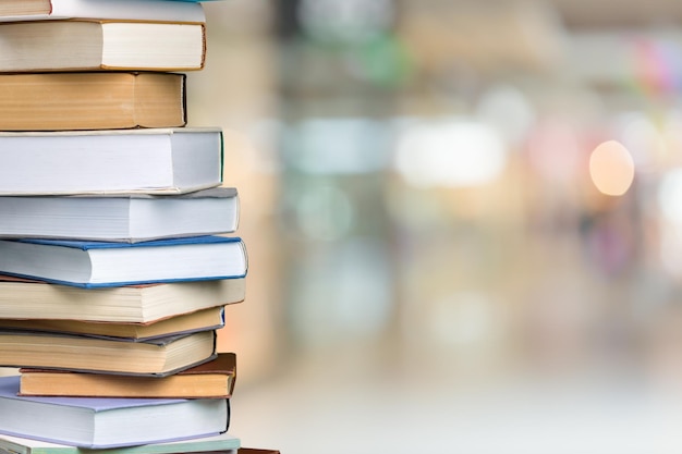 Collection of old books stack on blur background