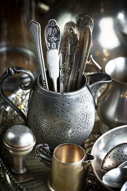 A collection of old kitchen utensils are on a counter.