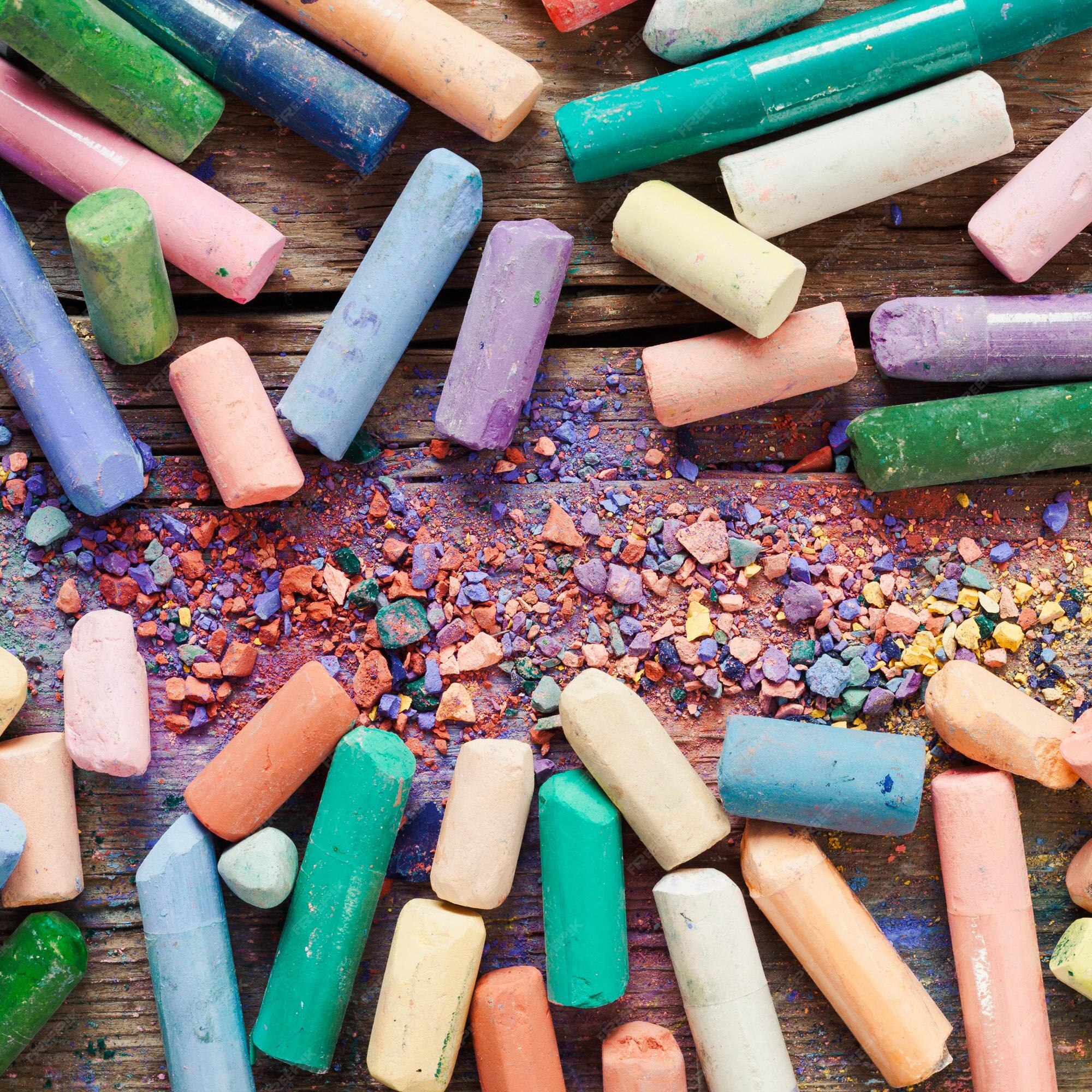 Premium Photo  Collection of rainbow colored artistic pastel crayons with  pigment dust on old wooden desk