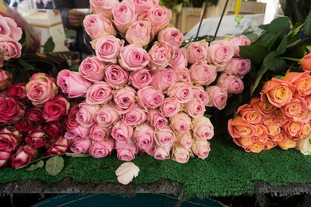 A collection or roses at a flower market