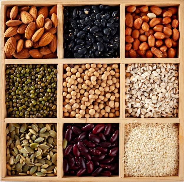 Collection series of peas, beans, lentils, peas in a wooden crate.