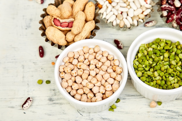 Collection set of beans and legumes. bowls of various lentils