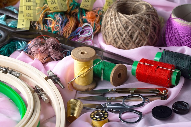 A collection of sewing supplies including a needle, thread, and needle.