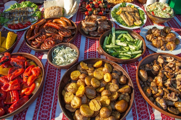 Collection of tasty dishes on table, closeup