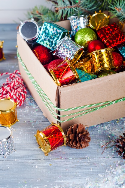 Collection of various Christmas decorations, placed into cardboard box