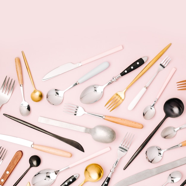 Collection of various cutlery on pastel background, flat lay, top view,