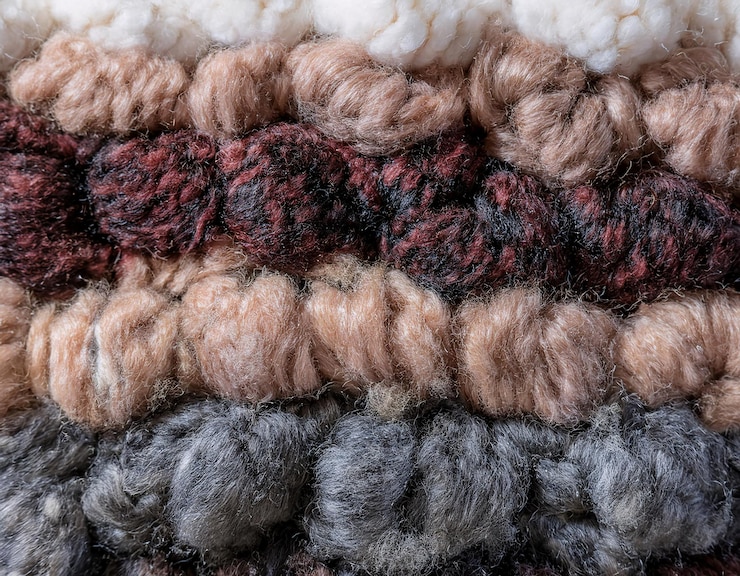 Photo a collection of woolen threads of various colors