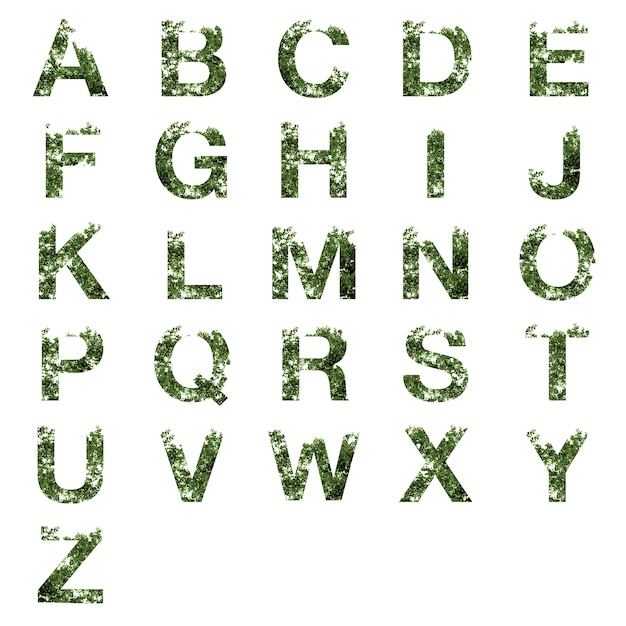 Photo collection of a-z alphabet letter double exposure with dark green leaves isolated on white