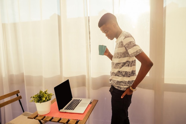 College student studying freelancer working with a laptop at veranda balcony freelance and remote work