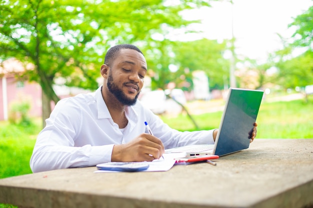 College Student Using Laptop On Campus