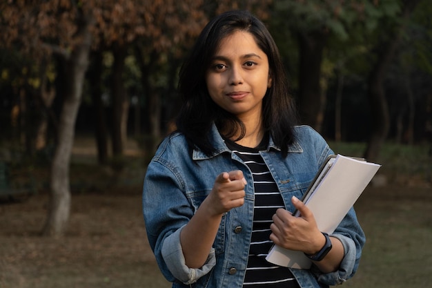 College student with books and bag