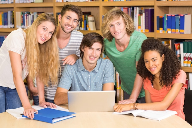 College students using laptop in library