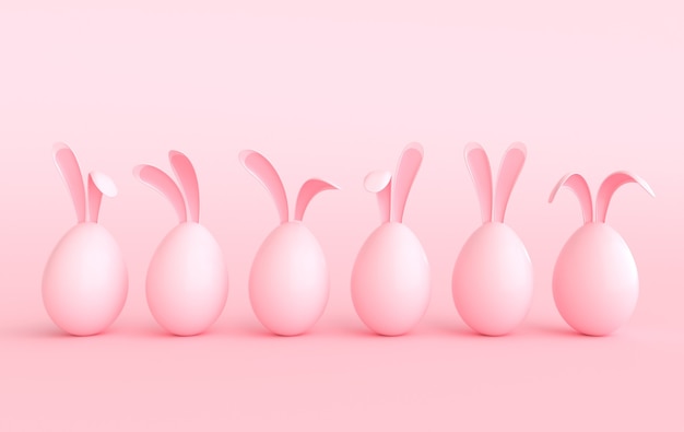 Collorful Easter egg with rabbit ears on pastel pink background