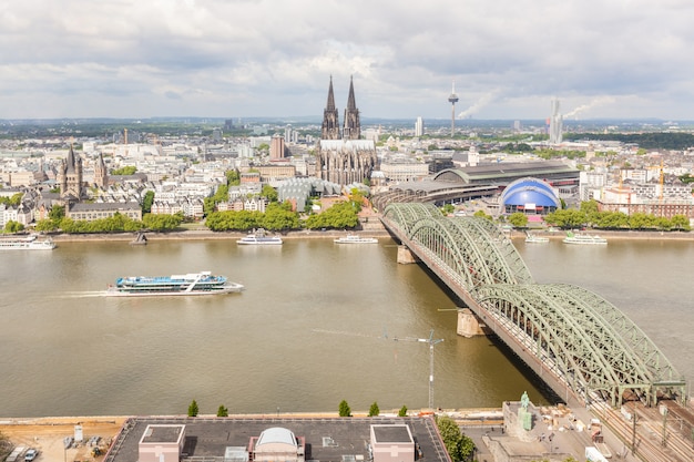 Cologne cathedral and famous bridge, aerial view