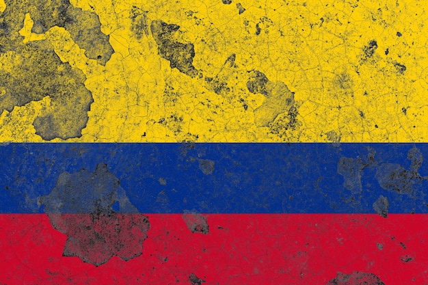 Colombia flag on a damaged old concrete wall surface