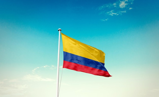Colombia national flag waving in beautiful sky