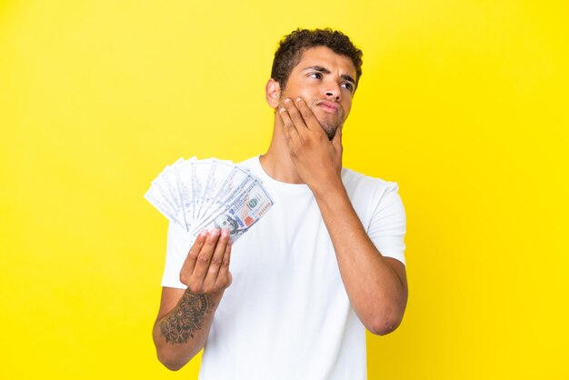 Colombian man over isolated background pleading