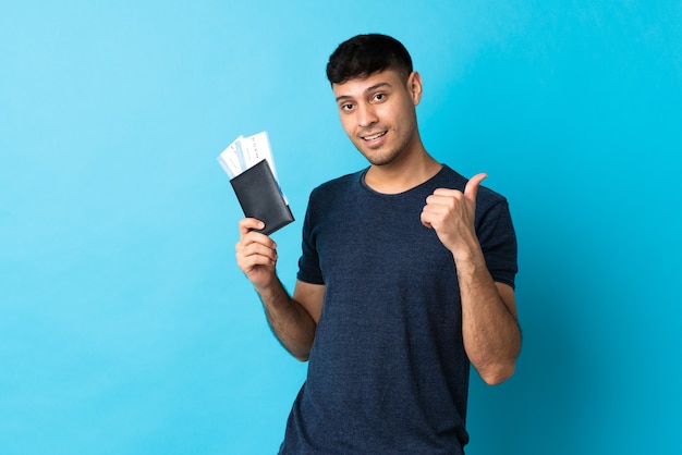 Colombian man isolated happy in vacation with passport and plane tickets