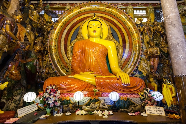 COLOMBO, SRI LANKA - FEBRUARY 27, 2017: Buddha statue inside Gangaramaya Temple in Colombo, Sri Lanka. Gangaramaya Temple is a buddhist temple with eclectic mix architecture.