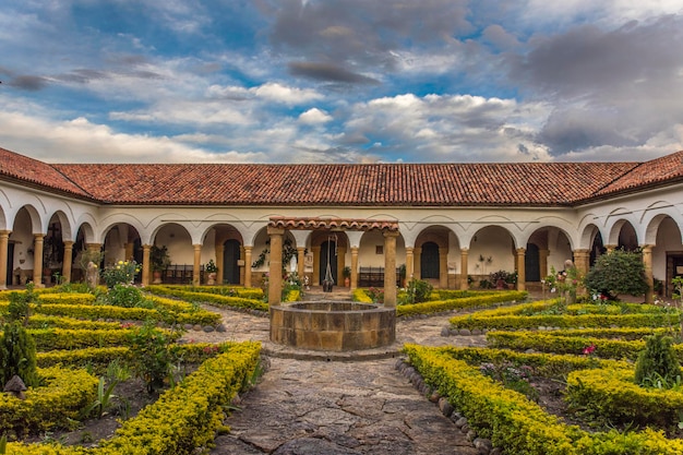 Colonial garden with a well in an old monastery