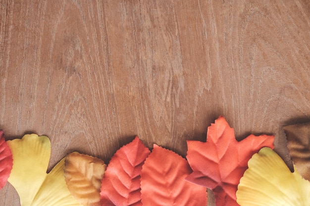 Color Autumn Leaves on Wood Table. 