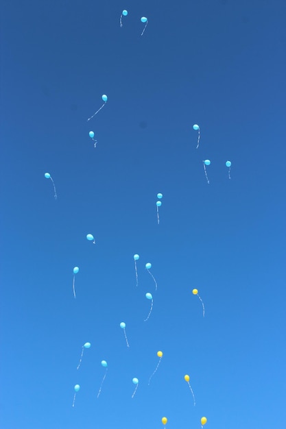 Color balloons flying away to the sky