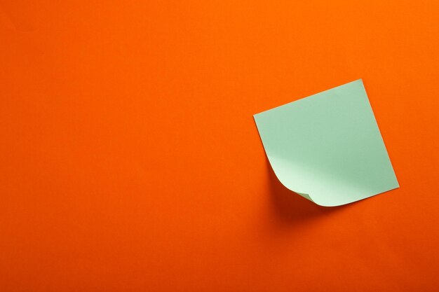 Color blank notepad on color background